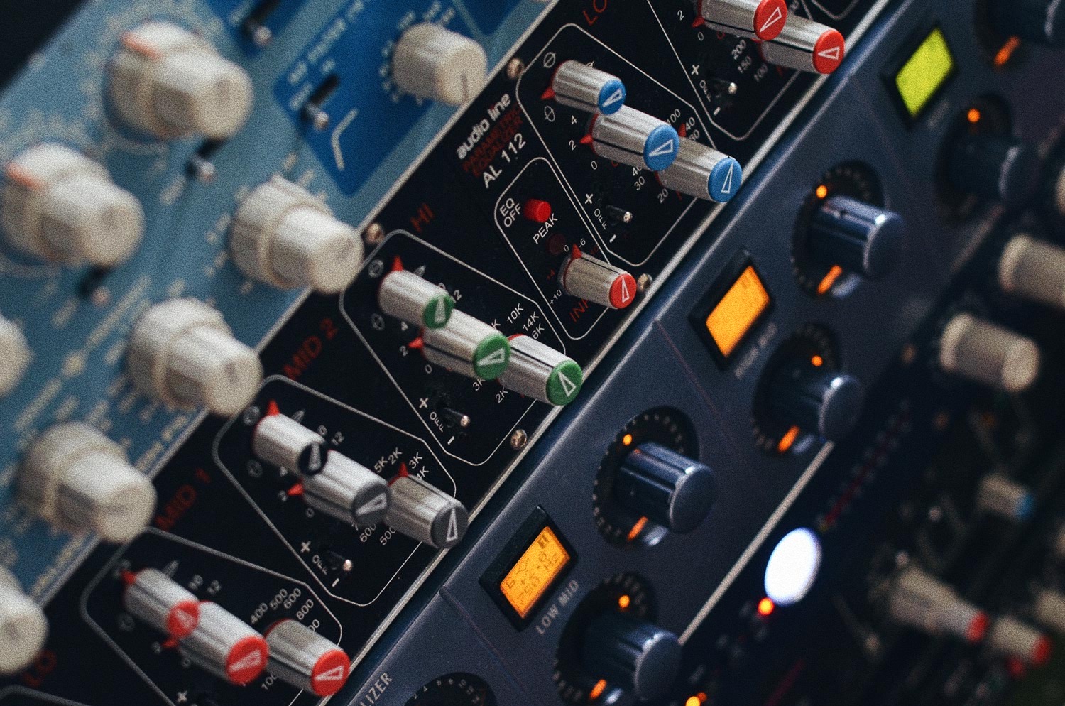 Hybrid mixing setup with analog console and digital plugins at Analogcut.